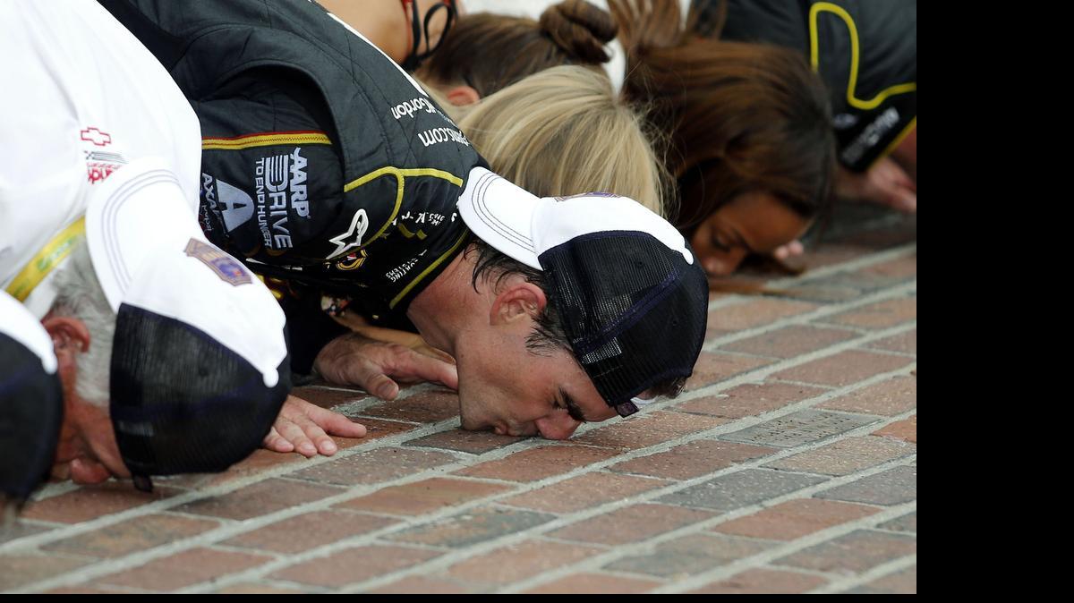 
Jeff Gordon celebrates by kissing the bricks after winning  last year’s NASCAR Brickyard 400 auto race at Indianapolis Motor Speedway in Indianapolis.
