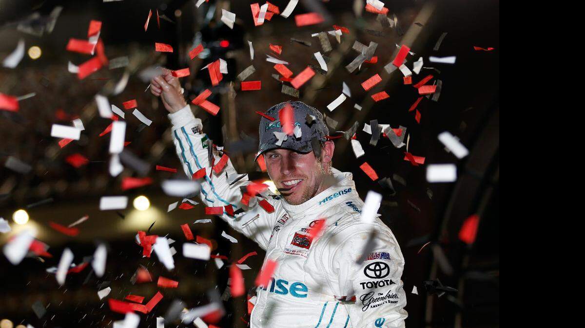 
Denny Hamlin celebrates in Victory Lane after winning the NASCAR XFINITY Series ToyotaCare 250 at Richmond International Raceway on Friday, April 24, 2015 in Richmond, Va.
