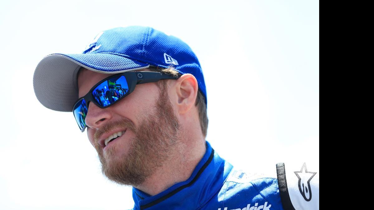 
Dale Earnhardt Jr. stands on the grid prior to the NASCAR Sprint Cup Series Axalta 'We Paint Winners' 400 at Pocono Raceway on Sunday, June 7, 2015 in Long Pond, Pa.
