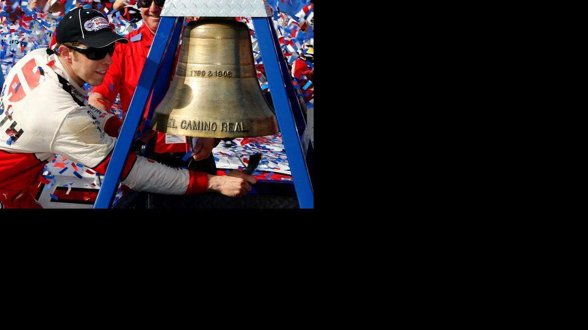 
Brad Keselowski rings the El Camino Real bell to celebrate winning the NASCAR Sprint Cup Series auto race in Fontana, Calif., Sunday, March 22, 2015. 
