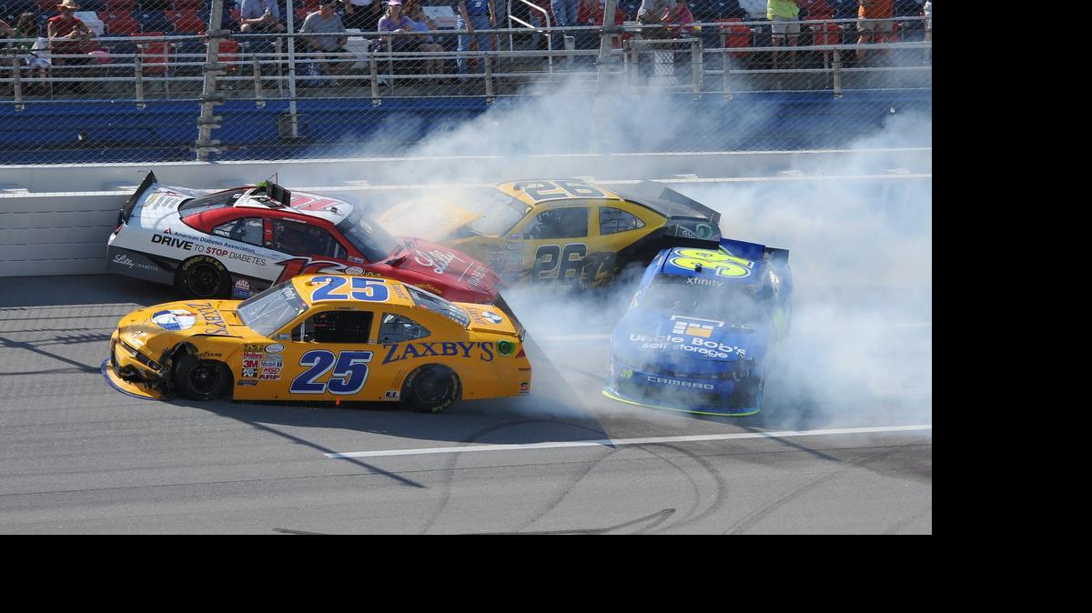 
Ryan Reed (16), John Wes Townley (25), Kenny Wallace (26) and Ryan Sieg (39) crash during the NASCAR Xfinity Series auto race at Talladega Superspeedway, Saturday, May 2, 2015, in Talladega, Ala. 

