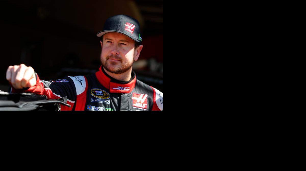 
Kurt Busch stands in the garage area during practice for the NASCAR Sprint Cup Series Auto Club 400 at Auto Club Speedway on March 20, 2015 in Fontana, Calif.
