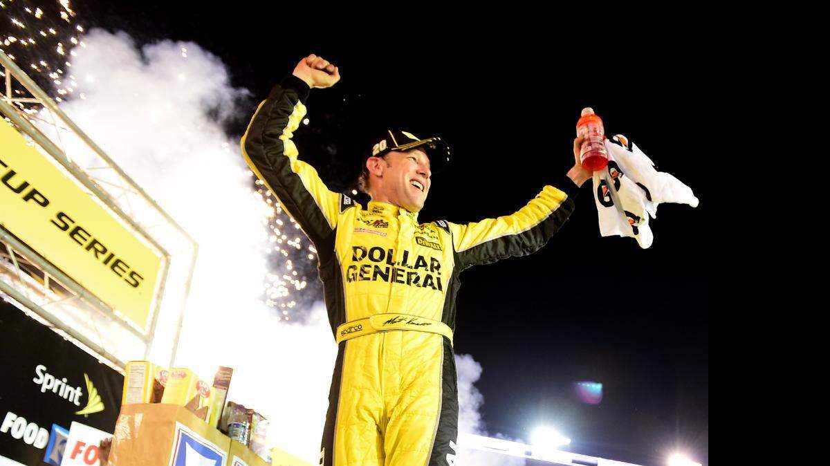
Matt Kenseth celebrates in Victory Lane after winning the NASCAR Sprint Cup Series Food City 500 at Bristol Motor Speedway. 
