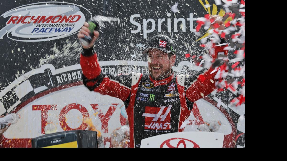 
Kurt Busch celebrates after winning the NASCAR Sprint Cup auto race at Richmond International Raceway in Richmond, Va., Sunday, April 26, 2015. 
