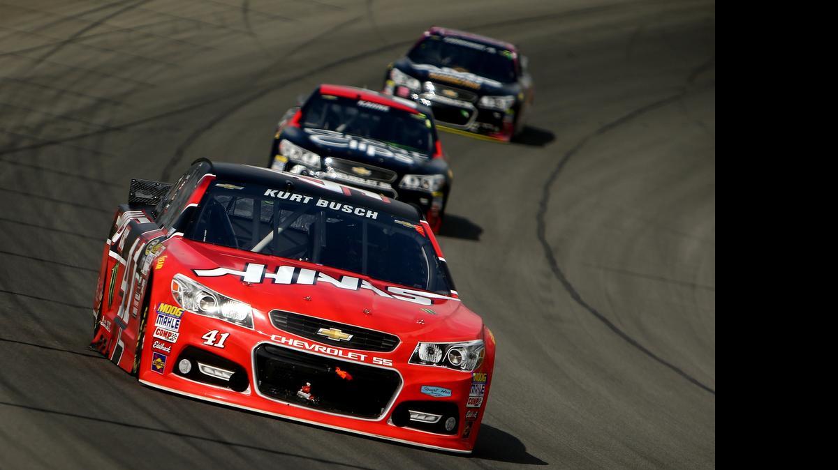 
Kurt Busch leads Kasey Kahne and Dale Earnhardt Jr.during the NASCAR Sprint Cup Series Quicken Loans 400 at Michigan International Speedway on Sunday, June 14, 2015 in Brooklyn, Mich.
