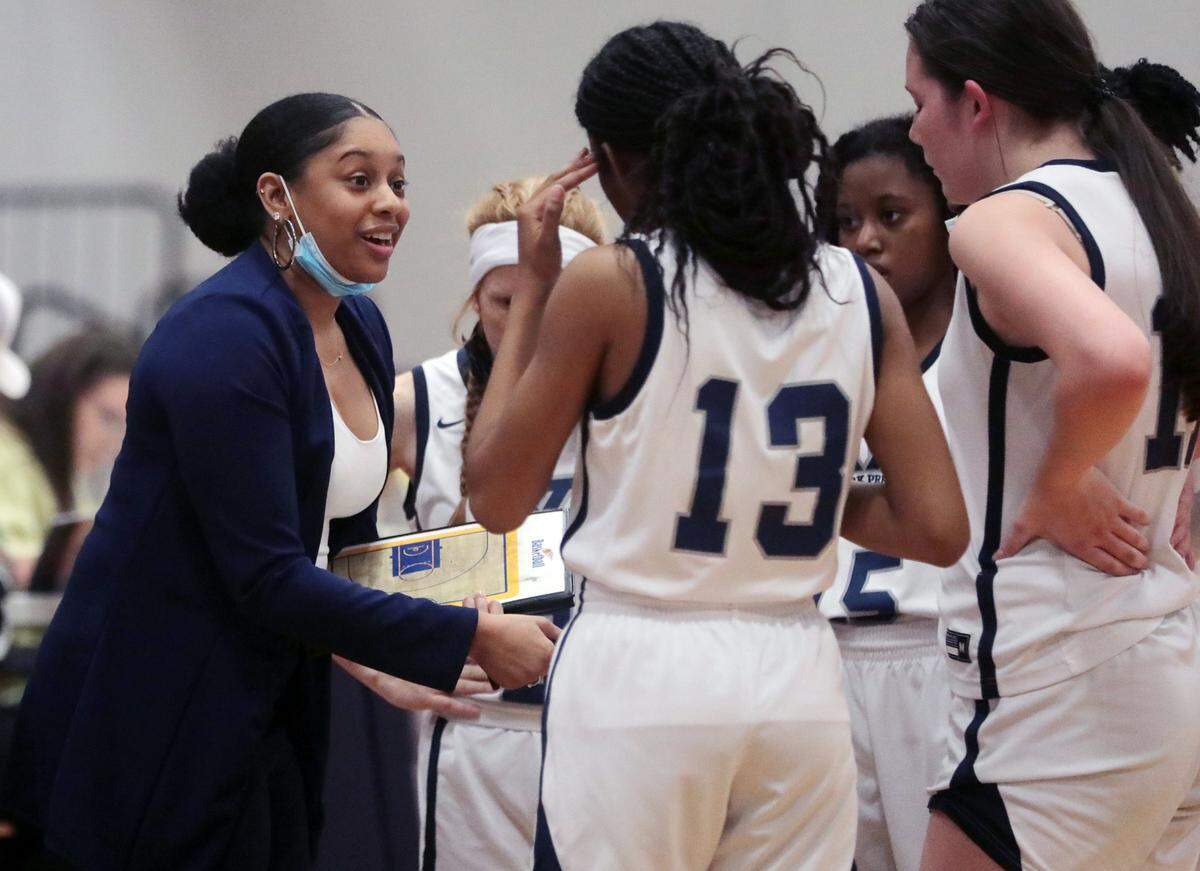 York Prep girls basketball coach Susan Scott talks to her team during a time-out.