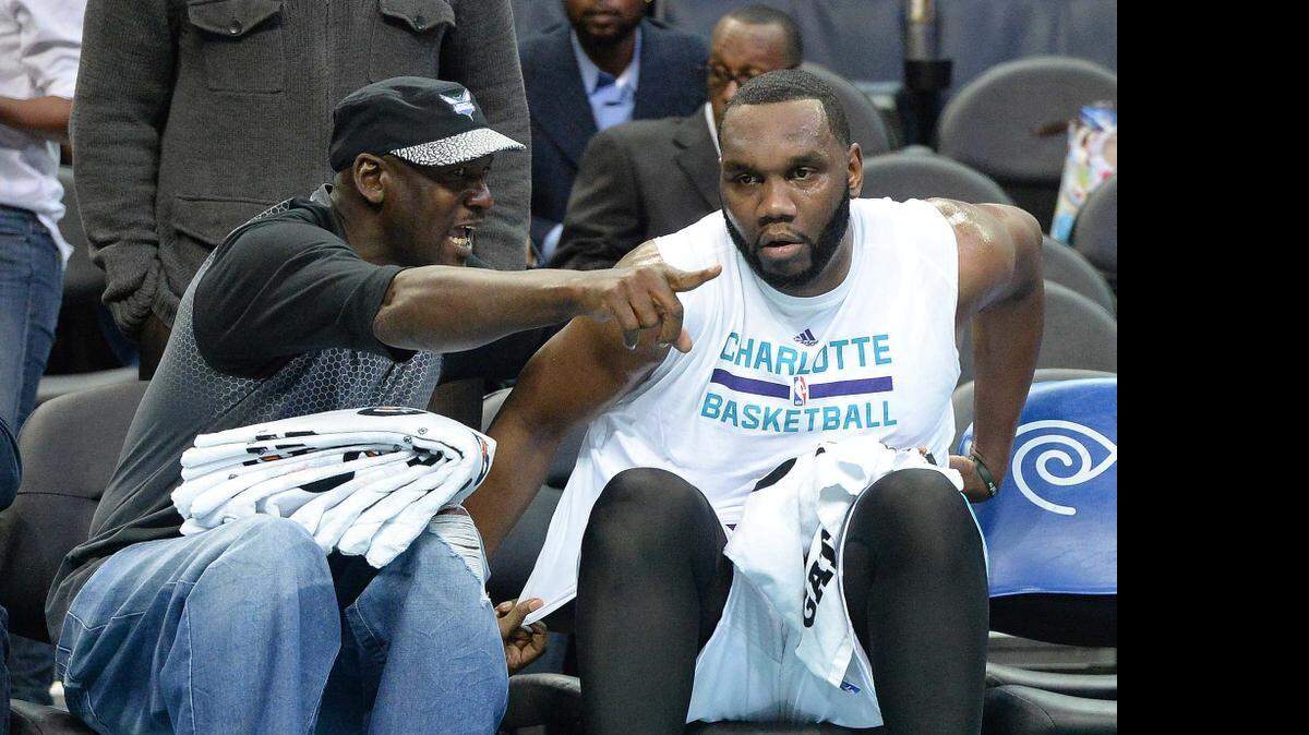 
Charlotte Hornets center Al Jefferson (right), pictured here with team owner Michael Jordan, says he needs to lose 20-25 pounds this summer to ease stress on his knees.
