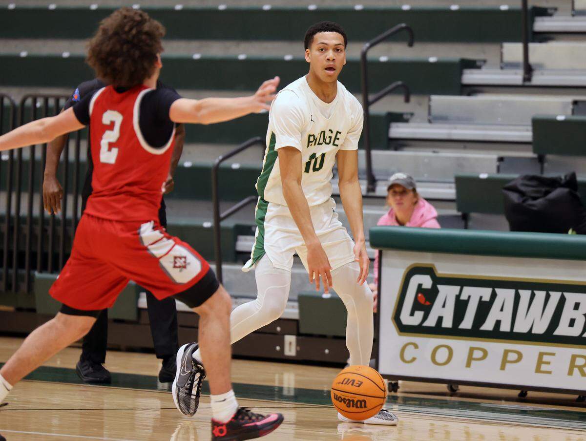 Catawba Ridge’s Lance Barnes looks up the court against Wade Hampon’s K.J. Banks.