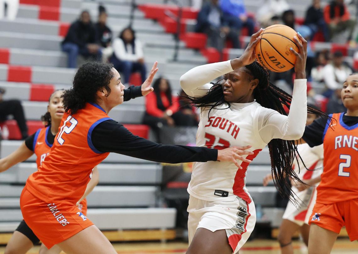 South Pointe’s JaNyia Cunningham looks for an opening around Richland Northeast’s Sasha Cebula Thursday in Rock Hill.