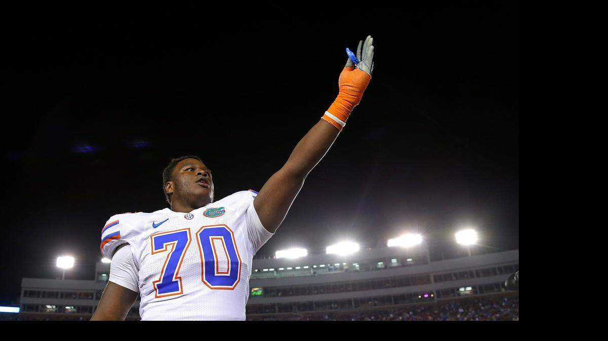
Florida’s D.J. Humphries (70)  waves to the crowd during a game against Florida State at Doak Campbell Stadium on Nov. 24, 2012 in Tallahassee, Fla.
