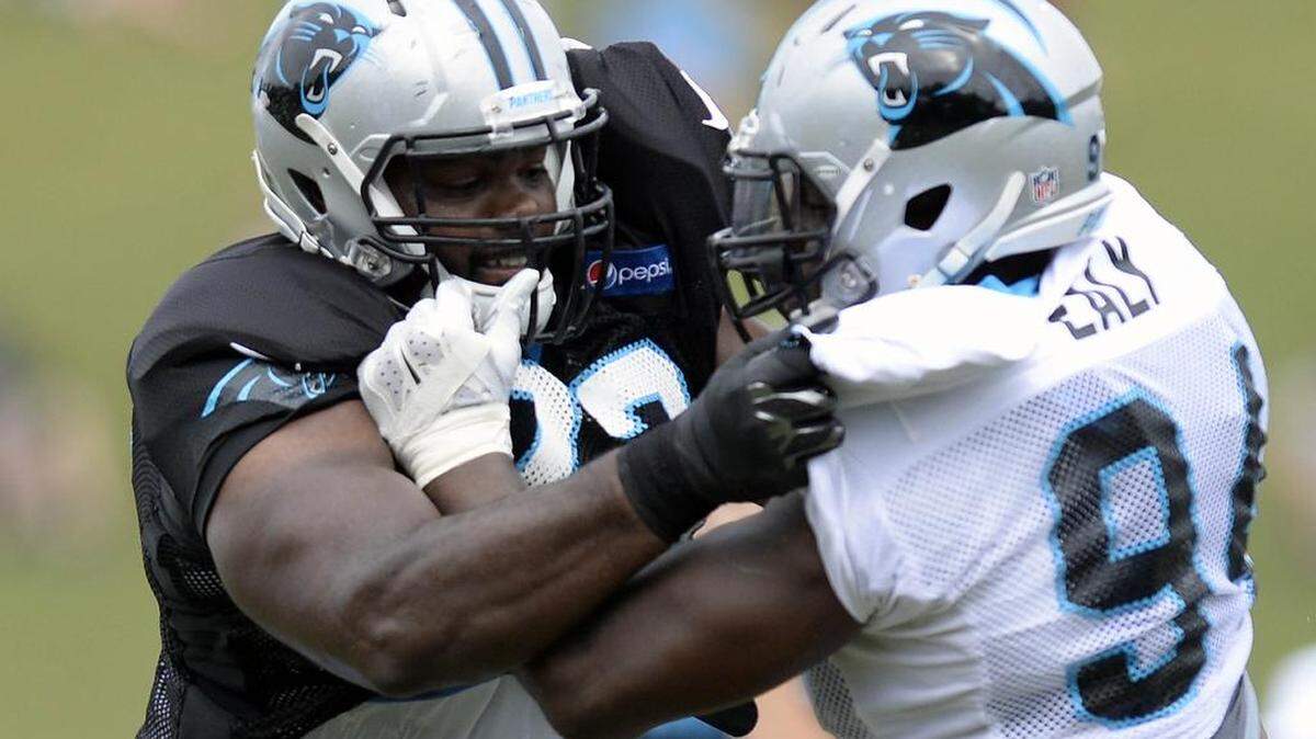 
Carolina Panthers tackle Michael Oher (73) and defensive end Kony Ealy (94) face off during a blocking drill on Monday. Head coach Ron Rivera and defensive coordinator Sean McDermott chastised the defense for its effort early in practice. 
