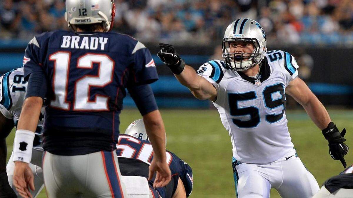 
Carolina Panthers linebacker Luke Kuechly, right, points and yells out instructions to the defensive line as New England Patriots quarterback Tom Brady prepares to call a play during second-quarter action at Bank of America Stadium in Charlotte on Friday.
