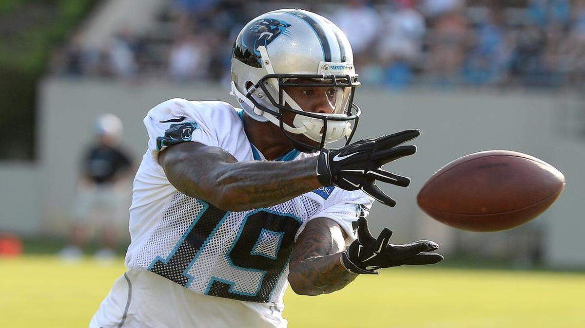 
Carolina Panthers wide receiver Ted Ginn Jr. left the Panthers for a payday in Arizona in 2014, but was happy to return. Here, he catches a pass during the team's first practice of training camp on Friday at Wofford College in Spartanburg.
