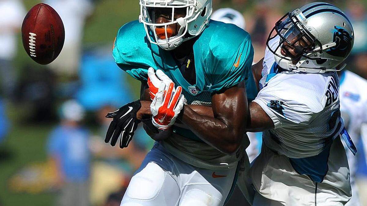 
Carolina Panthers cornerback Bene Benwikere, right, knocks the ball away from Miami Dolphins wide receiver Michael Preston, left, on a pass play during practice on Thursday, Aug. 20, 2015. The Panthers hosted the Miami Dolphins in a joint practice at Wofford College in Spartanburg.
