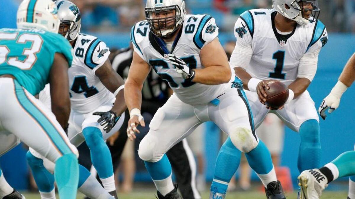 
Carolina Panthers center Ryan Kalil (67) prepares to block after he hiked the football to quarterback Cam Newton (1) against the Miami Dolphins during the first half of an NFL preseason football game Saturday. 
