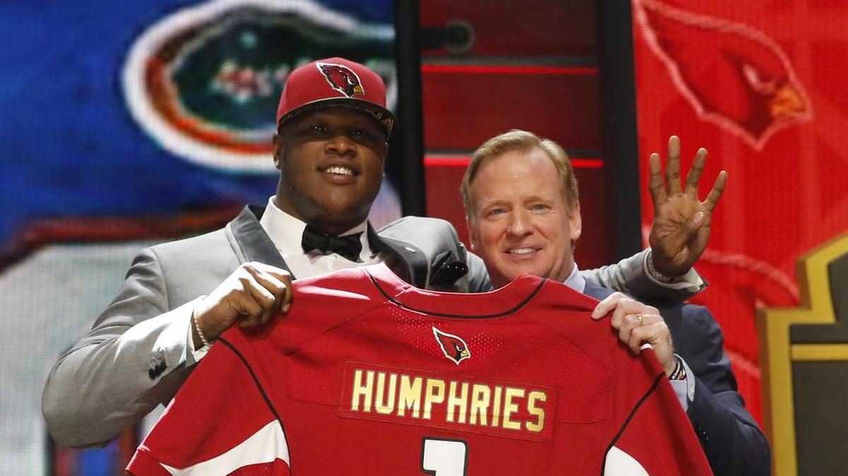 
Florida offensive lineman D.J. Humphries, a Mallard Creek High graduate, poses for photos with NFL commissioner Roger Goodell after being selected by the Arizona Cardinals as the 24th pick in the first round of the 2015 NFL Draft.

