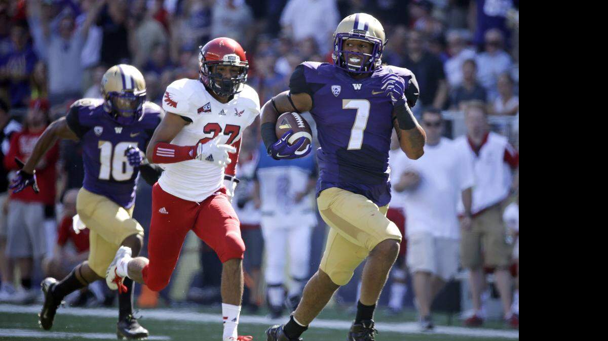 
Washington linebacker Shaq Thompson (7) had six touchdowns for the Huskies in 2014, including two at running back. His best NFL position, based on his size and strength, could be safety. 
