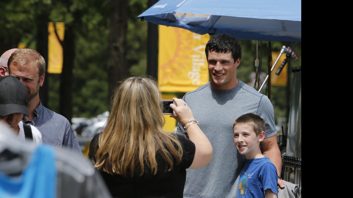 Luke Kuechly with the Carolina Panthers was in Baxter Village in Fort Mill Wednesday filming a TV commercial. He stopped to have his picture made with Baxter resident Brian Wisniewski, 12. Brian's mom, Kelly, was taking the picture.