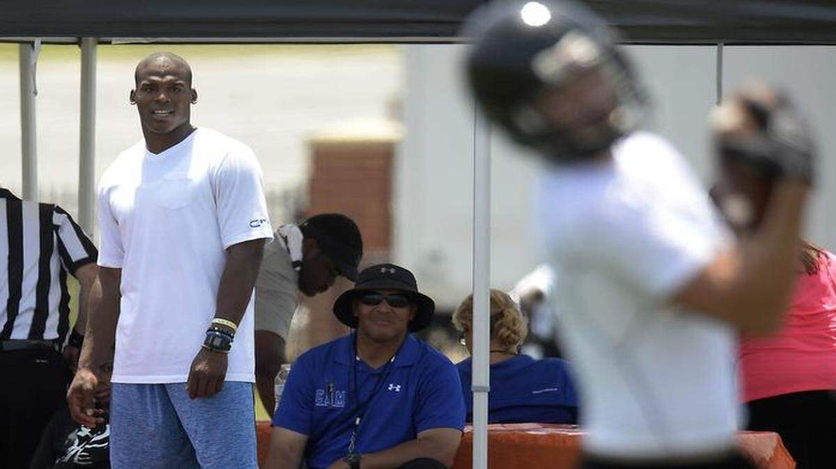 
Carolina Panthers quarterback Cam Newton, center, watches teams play during the first day of the Cam Newton Foundation 7 v 7 High School Football Tournament Championship at Nation Ford High in Fort Mill on Friday.

