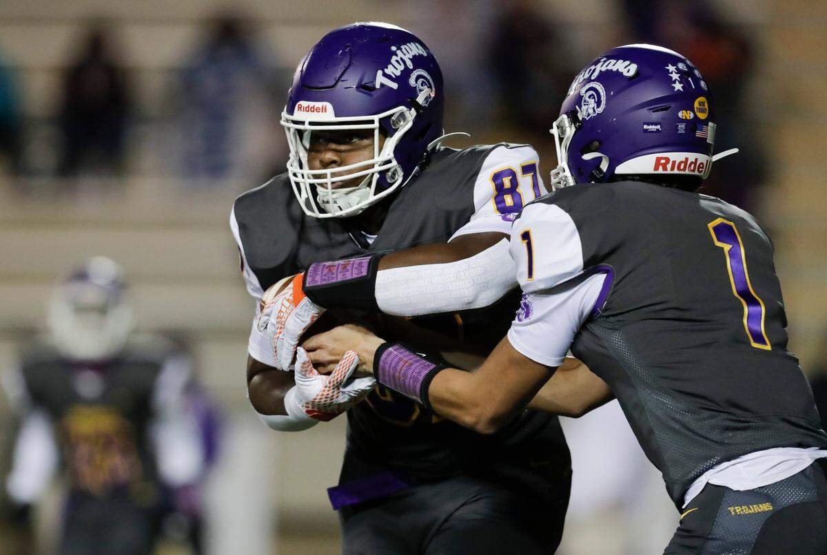 Northwestern quarterback #1 Will Mattison hands off to #87 Kyle Aldridge in early play as Northwestern hosts Spring Valley in Friday night varsity football. 10-30-2020.