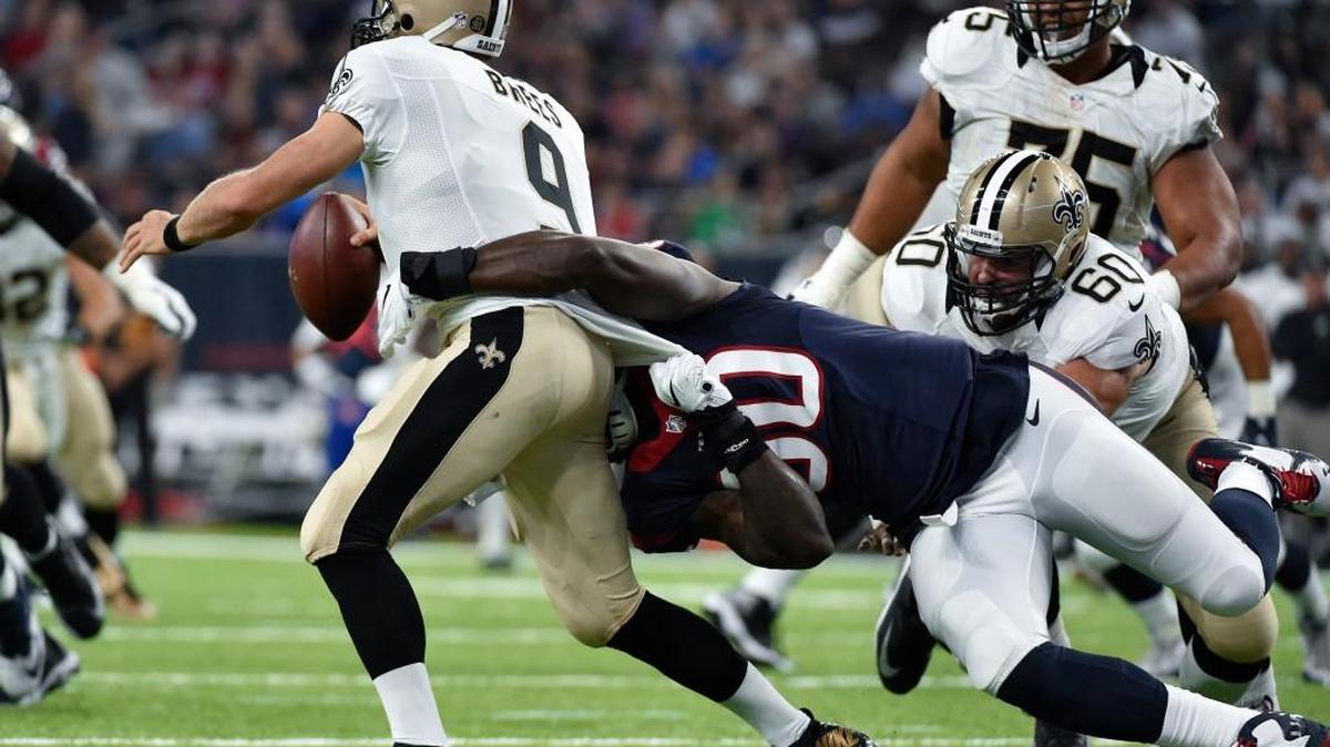 Houston Texans outside linebacker Jadeveon Clowney sacks New Orleans Saints quarterback Drew Brees in the first half of an NFL preseason football game in Houston on Saturday.