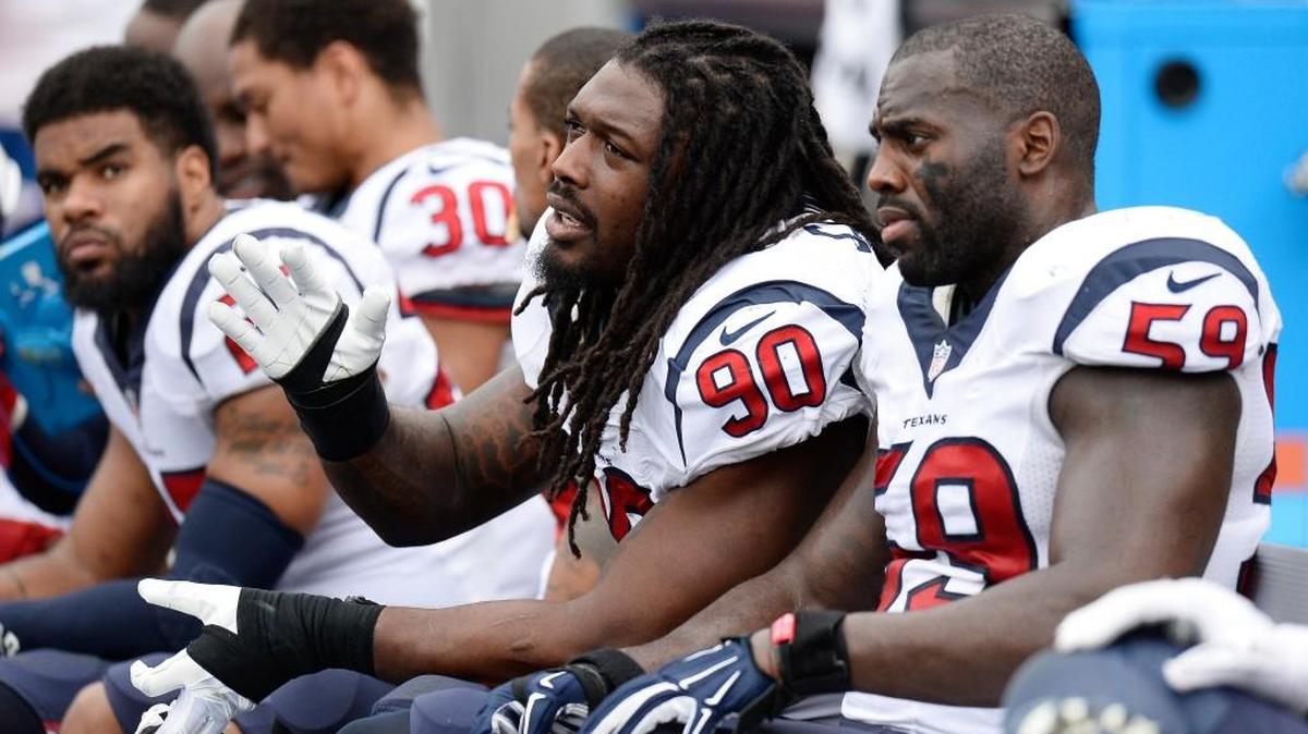 Houston Texans outside linebacker Jadeveon Clowney (90) sits on the bench with linebacker Whitney Mercilus (59) in the second half of an NFL football game against the Tennessee Titans Sunday, Dec. 27, 2015, in Nashville, Tenn.