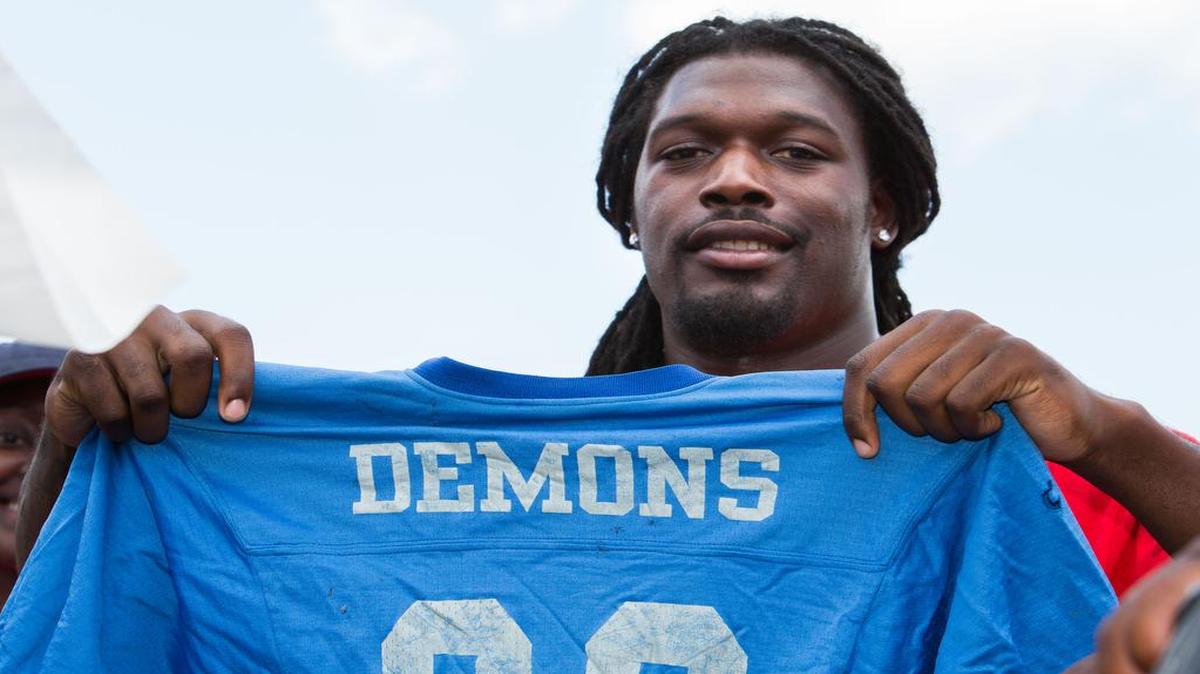 Jadeveon Clowney holds his original Sylvia Circle Demons jersey Saturday in a ceremony to retire his number. 6-20-2015.
