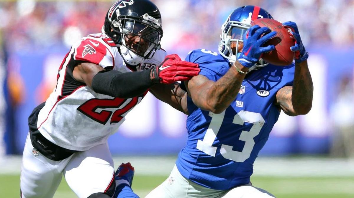 
New York Giants wide receiver Odell Beckham Jr. No. 13 makes a catch in front of Atlanta Falcons defensive back Phillip Adams No. 20 during an NFL game at MetLife Stadium in East Rutherford, N.J. on Sunday, Sept. 20, 2015.
