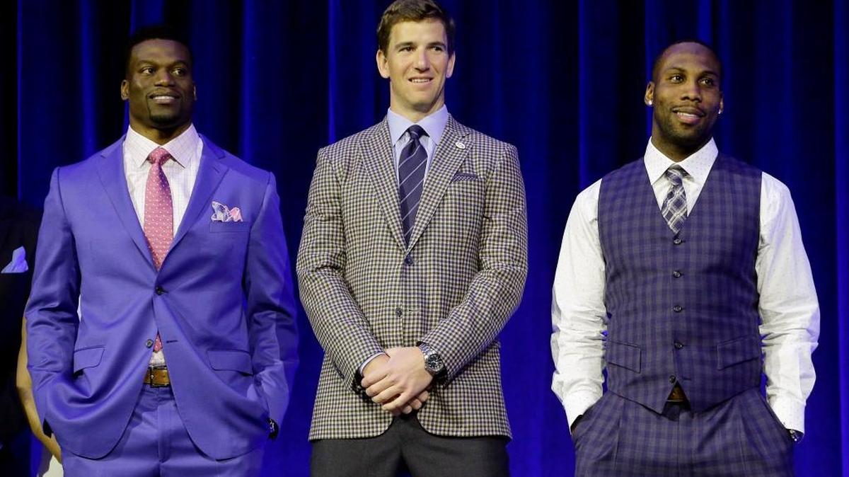 New Orleans Saints' Benjamin Watson, left, New York Giants' Eli Manning, center, and San Francisco 49ers' Anquan Boldin for the Walter Payton NFL Man of the Year. Boldin was named the winner Saturday.