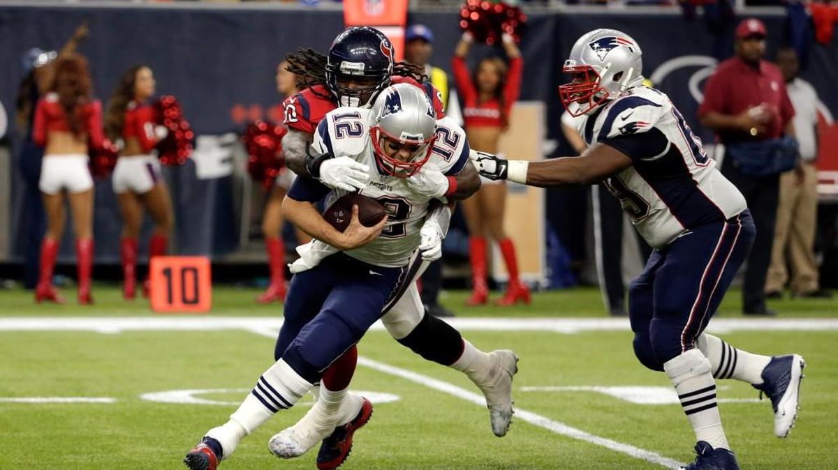 Houston Texans outside linebacker Jadeveon Clowney (90) sacks New England Patriots quarterback Tom Brady (12) during the second half of an NFL football game, Sunday, Dec. 13, 2015, in Houston.
