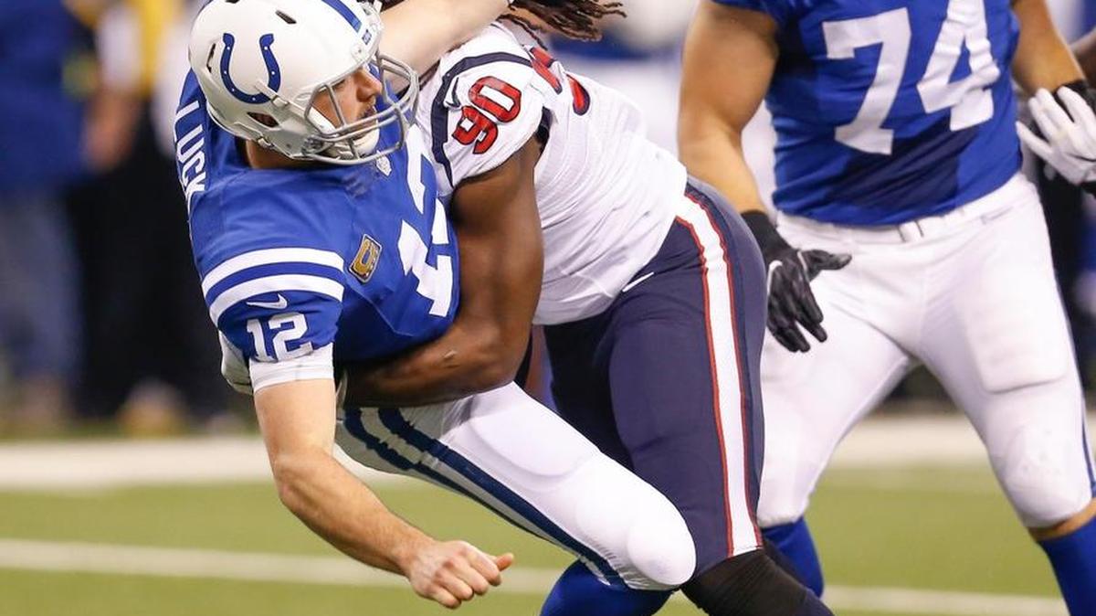 Houston Texans defensive end Jadeveon Clowney (90) slams Indianapolis Colts quarterback Andrew Luck (12) to the turf during the first half of the Colts vs. Texans game at Lucas Oil Stadium Sunday, Dec. 11, 2016 in Indianapolis, Ind. The Texans won 22-17.