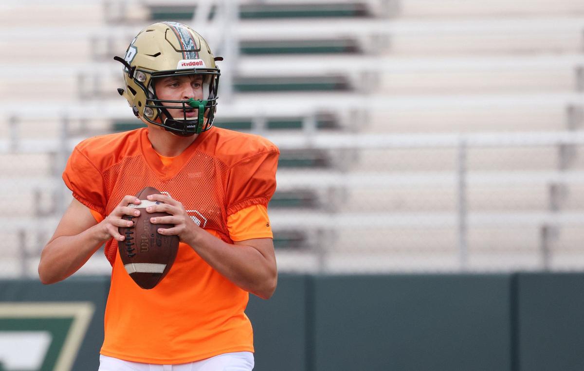 Catawba Ridge High School varsity football quarterback C.J. Couch practices Tuesday at the school.