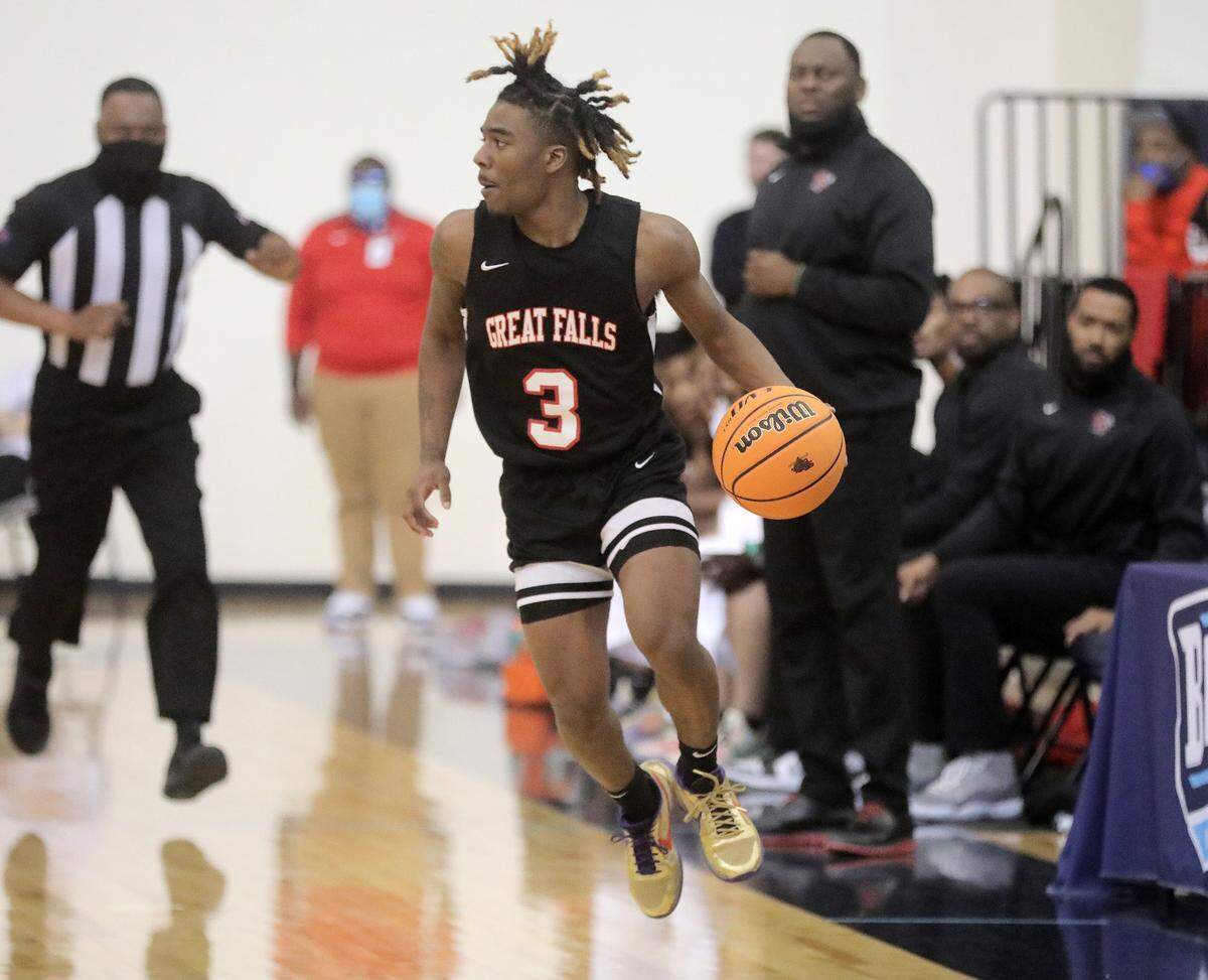 Great Falls’ Xavien Moore dribbles down the court.