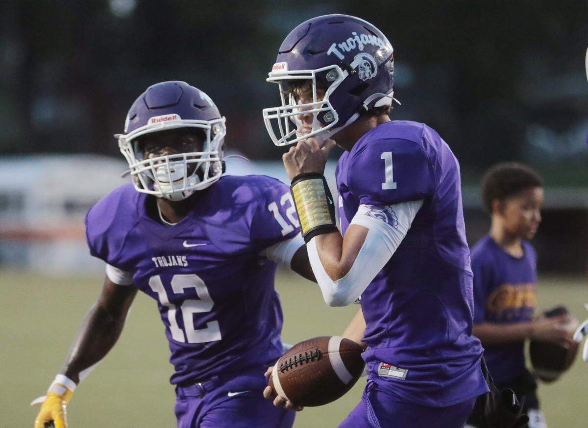 Herald file: Northwestern’s Will Mattison (1) and Calique Cunningham celebrate in the endzone.