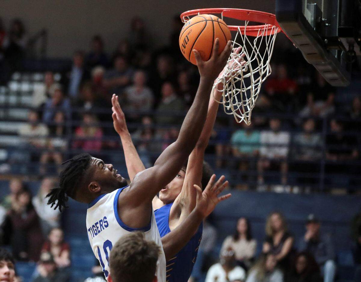 Clover’s Darius Bowser puts up the shot against Fort Mill’s Will Stumpf.