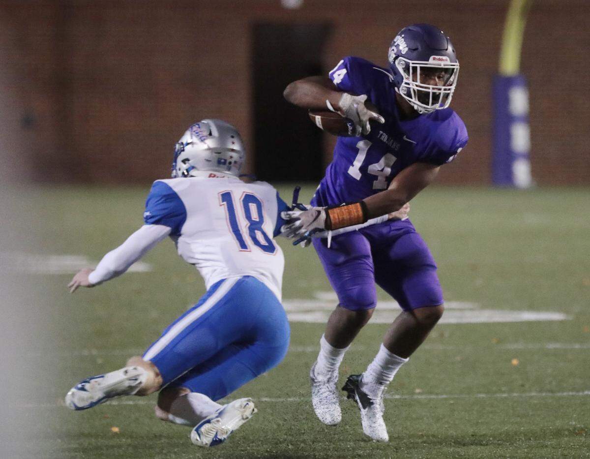 Byrnes’ Will Fowler tries to stop Northwestern’s Turbo Richard.