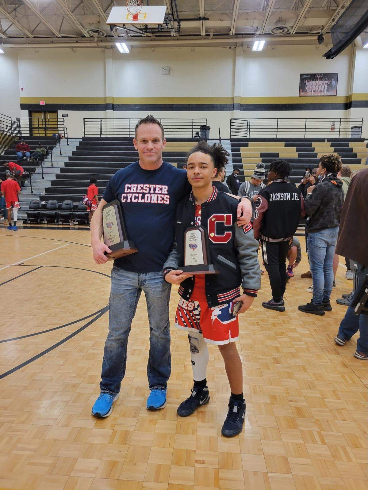 Trent Bowser of the Chester wrestling team, left, with his coach Dennis Jensen.