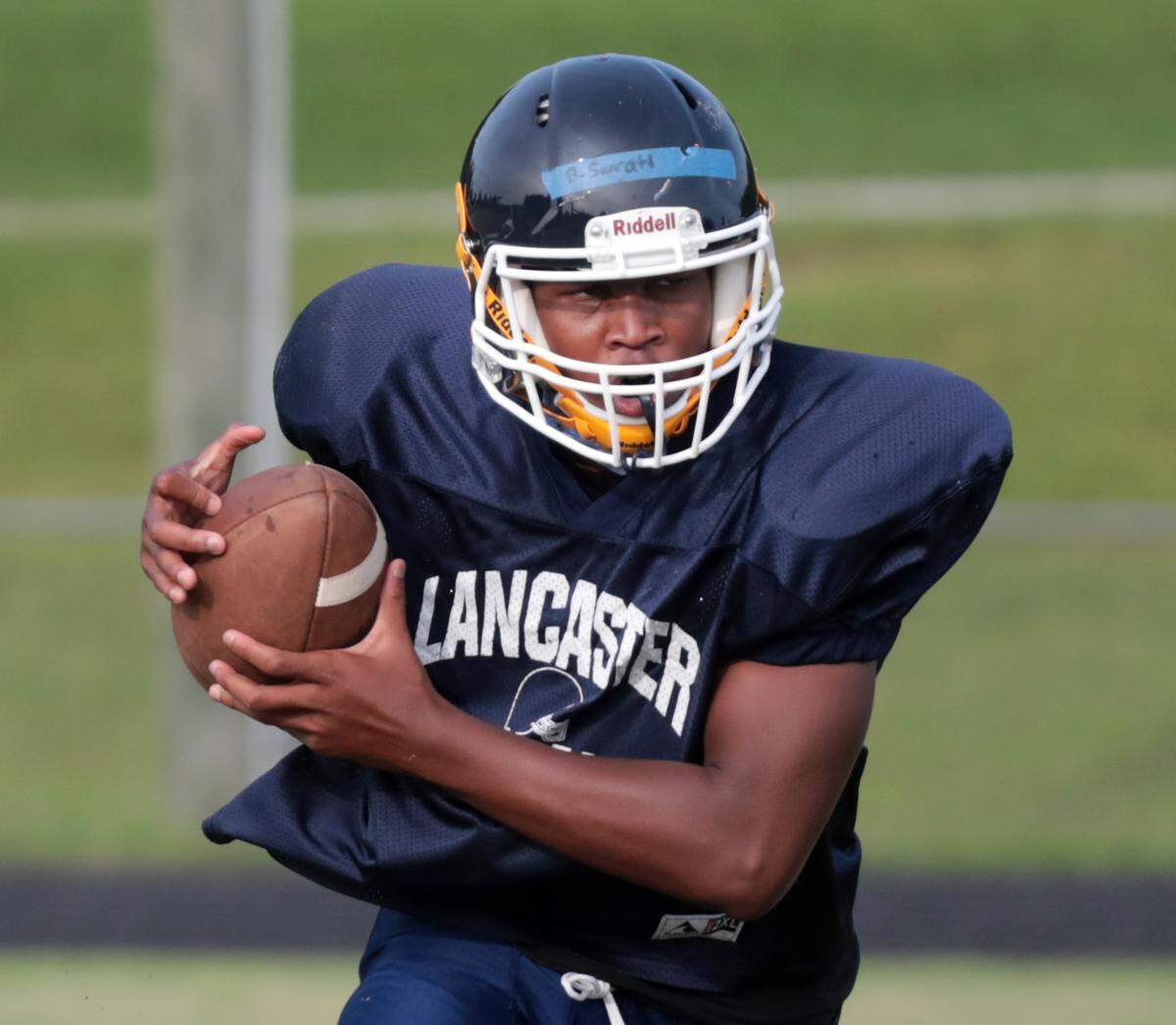 Lancaster High School varsity football player Bryce Surratt practices at the school on Tuesday.