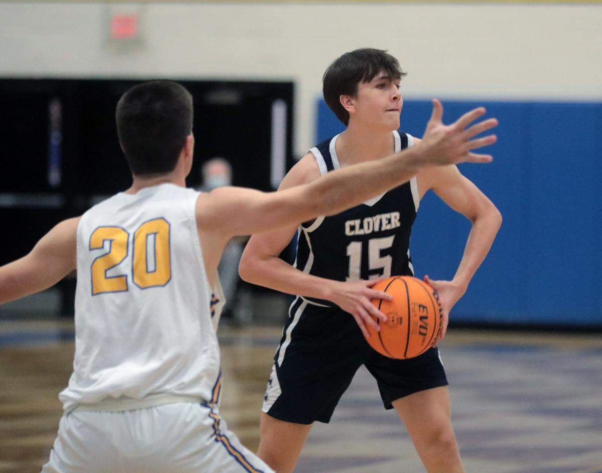 Clover’s Allen Roberts looks for an opening against Fort Mill’s Wade Blythe.