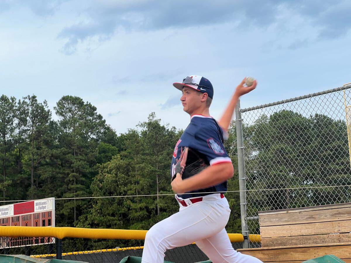 First baseman Gavin MacDonald warms up his arm ahead of Rock Hill Post 34’s 14-1 victory over Anderson Post 14 Wednesday night.