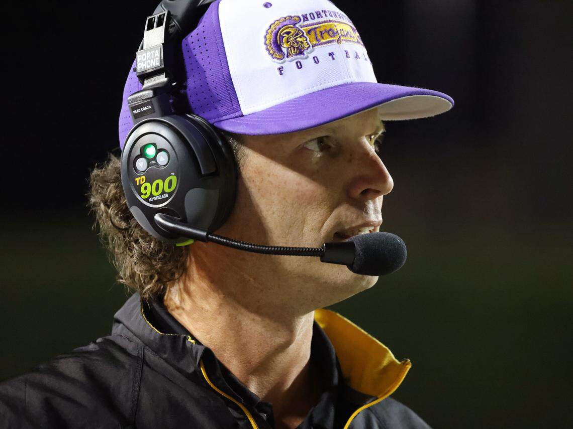 Northwestern High School head football coach Page Wofford watches the game between the Trojans and the Bearcats.
