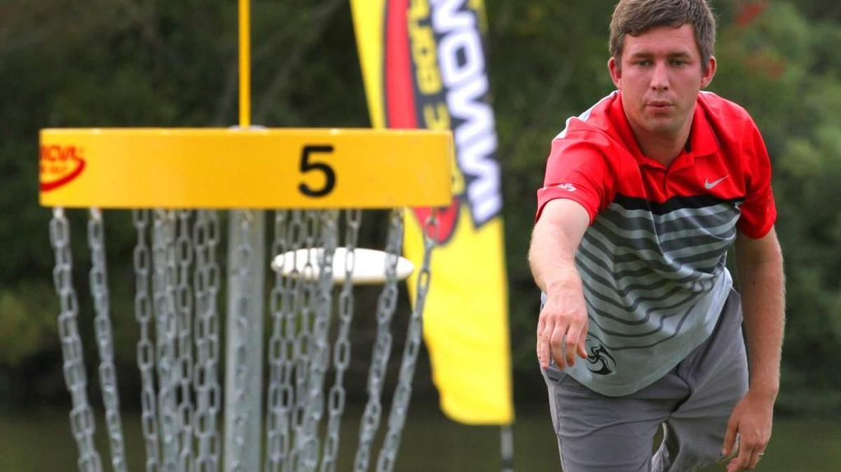 
Nate Sexton of Chapel Hill, N.C., makes his birdie putt on the par-5, 1,083-foot 5th hole during the third round of the U.S. Disc Golf Championship at Winthrop University’s Gold Course on Friday. Sexton leads by three strokes going into Saturday’s final round.
