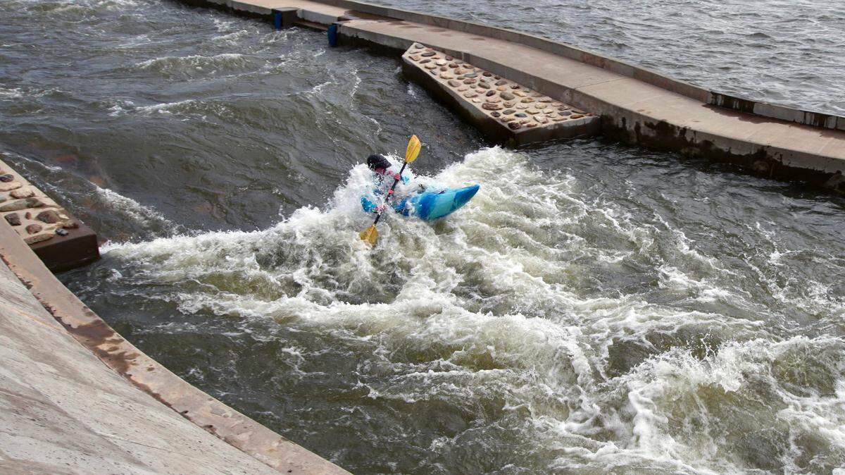 A kayaker takes on a rapid on March 19 in the “paperclip” in Great Falls, S.C.