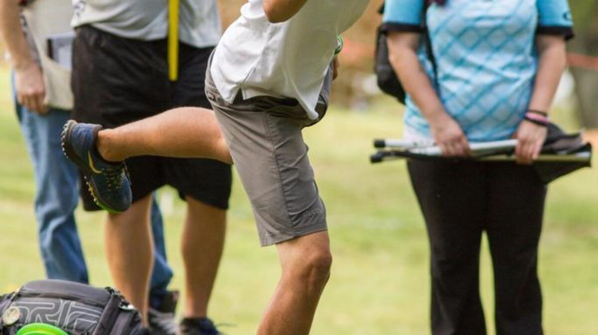 Eagle McMahon of Boulder, Colo., throws his second shot on hole No. 18 at Winthrop Gold disc golf course on Thursday. He is the round two leader.