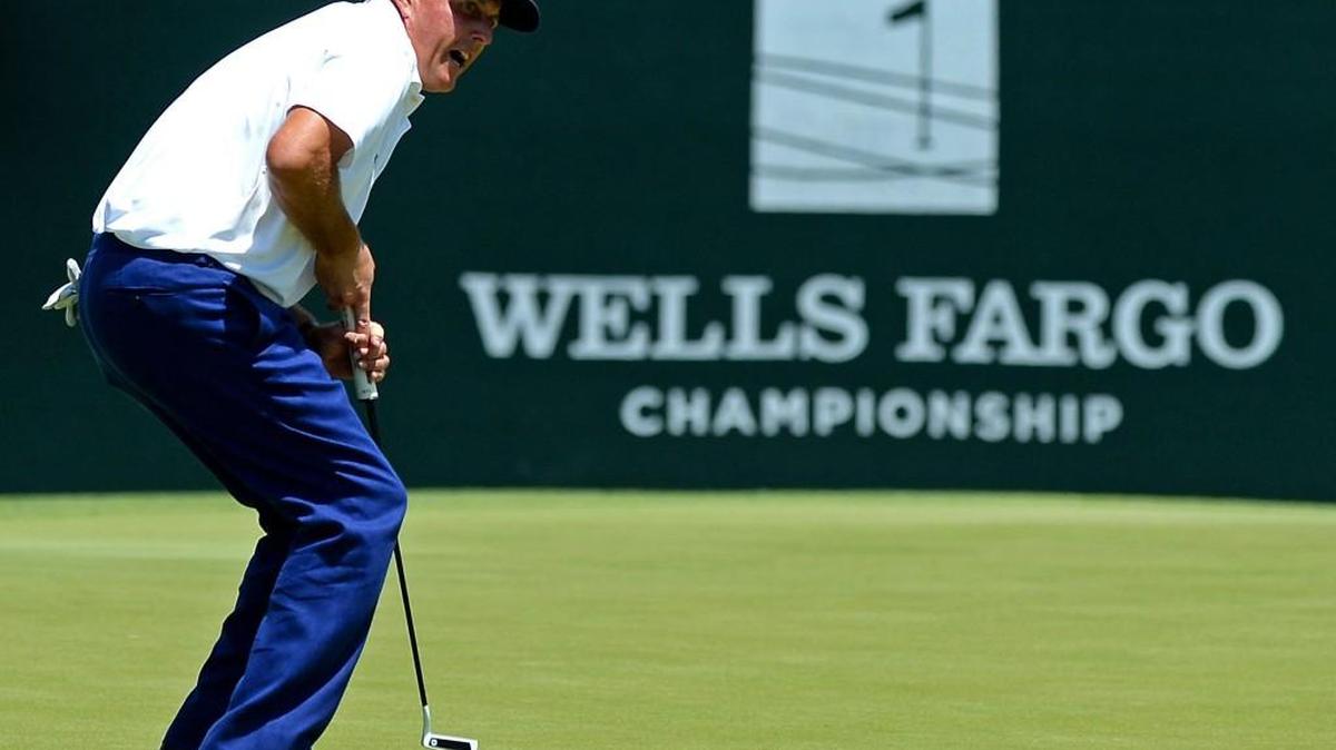Phil Mickelson reacts to a missed putt on the third green during Sunday’s final round of the Wells Fargo Championship. He finished tied for fourth place after shooting a 6-under 66.