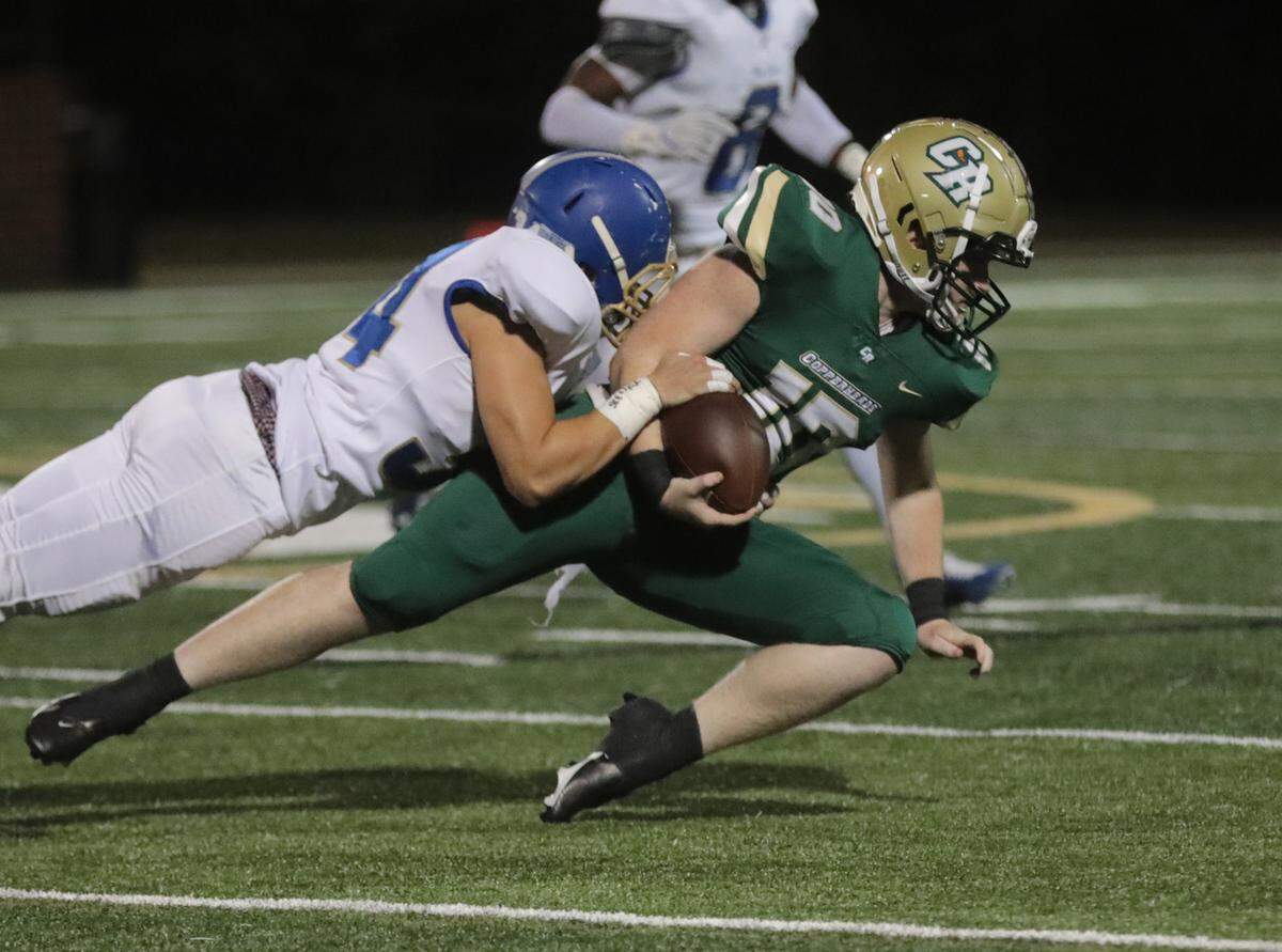 Catawba Ridge’s Nate Thomas is brought down by Indian Land’s Anthony Rodriguez in a 2021 regular season game.