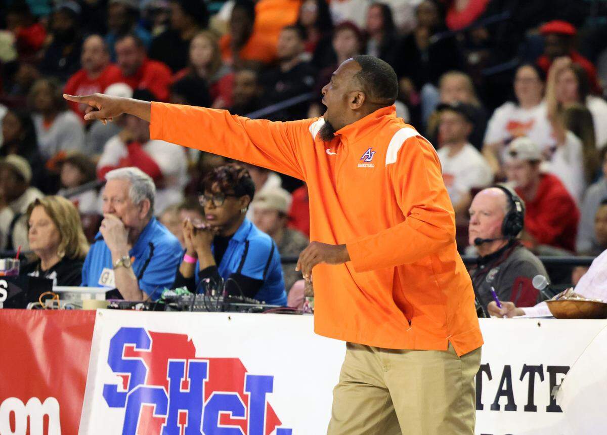 Coach Steven Fair with the Andrew Jackson High School girls basketball game yells to his players Friday at the S.C. Class 2 A girls championships in Florence, S.C.