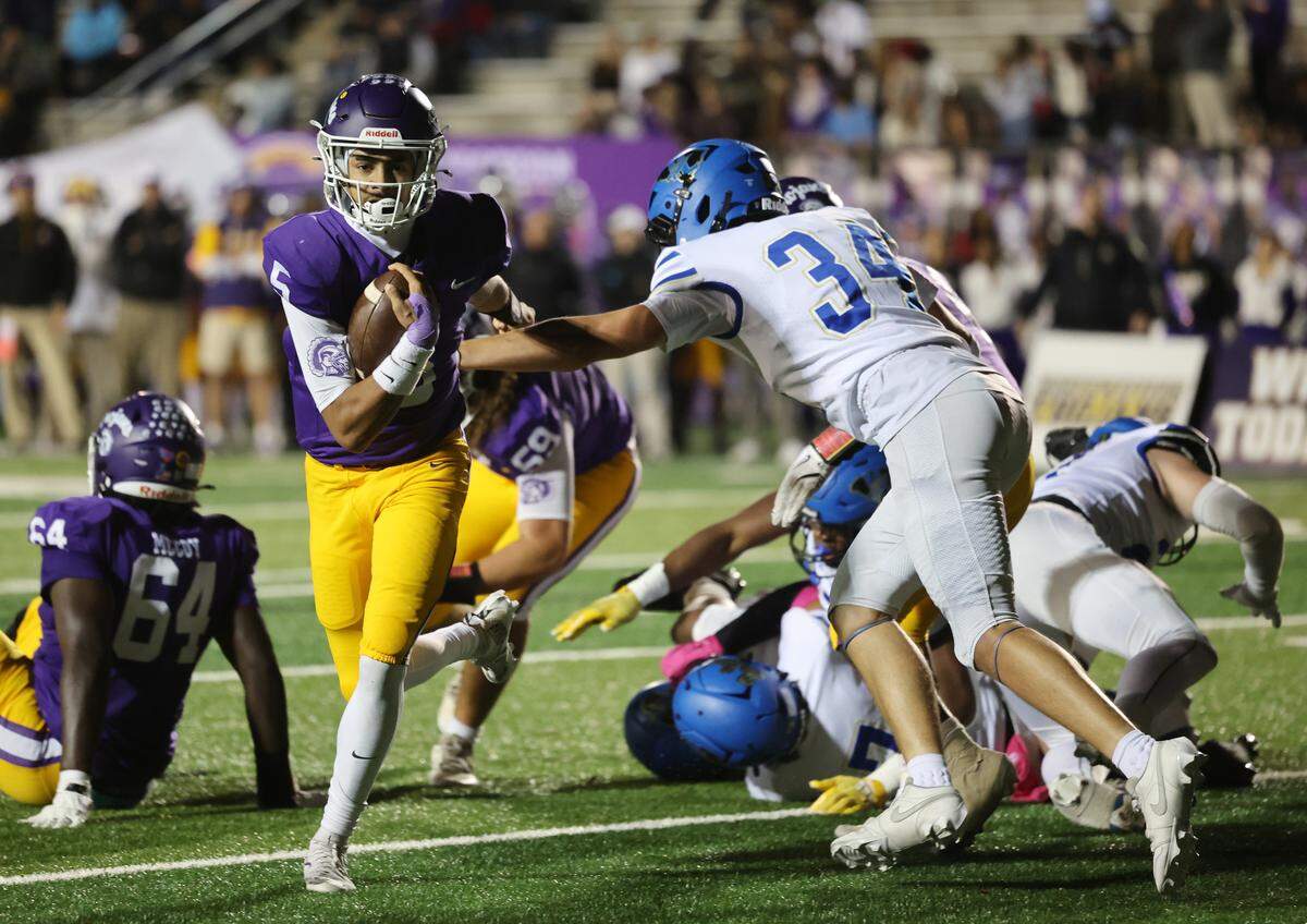 Northwestern's Xavier Means heads to the end zone around Indian Land's C.J. Petri (34) Friday, Oct. 31, 2025 in Rock Hill, S.C.