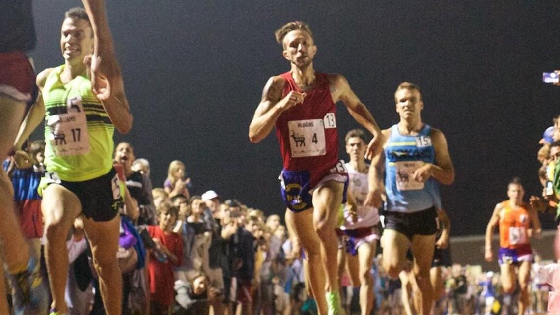 
Barely touching the ground, Brandon Hudgins races toward the finish of the Sir Walter Miler in early August.

