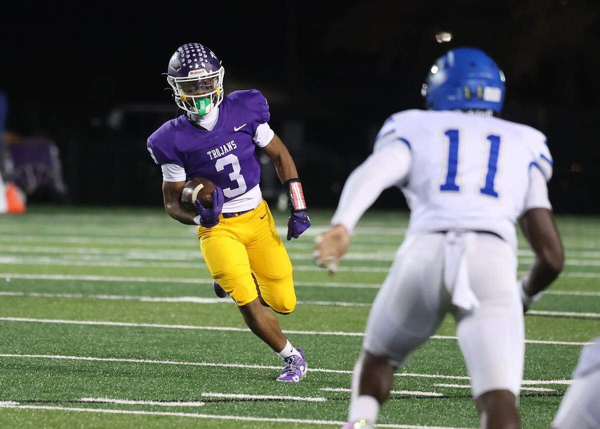 Northwestern's Kameron Vance carries the ball Friday, Oct. 31, 2025 as the Trojans take on the Indian Land Warriors in Rock Hill, S.C.